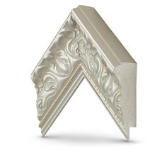 the corner of a white decorative object on a white background