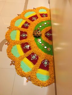 a decorated cake on the floor with decorations