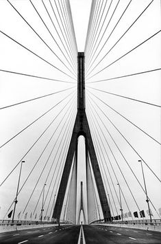 a black and white photo of a bridge