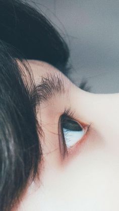 a close up view of a woman's eye