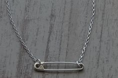 "This is a Sterling Silver Safety Pin Necklace which is 17.50 inches(44.5 cm) long.The safety pin on the necklace is 1.18 inches(3 cm) long. The weight of the necklace is 3.4gr. Please leave a note if you want diffirent length. I hallmark all the items.Here is some details of the item: Sterling Silver-Glossy finish-Hand made-925 Stamped The Sterling Silver Safety Pin Necklace is shipped in a really nice gift box. Here is some general information about Sterling Silver: Sterling silver is an alloy How To Make A Safety Pin Necklace, Safety Pins Necklace, Safety Pin Necklace, Safety Pin Bracelet, Girlfriend Necklace Gift, Girlfriend Necklace, Necklace Drawing, Safety Pin Jewelry, Pin Necklace