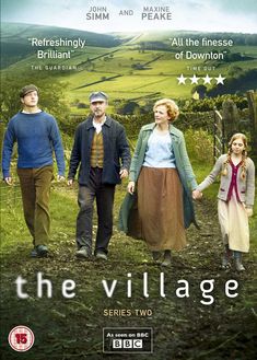 the village on dvd with two people holding hands and walking down a dirt path in front of