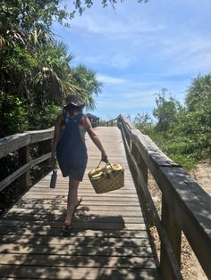 friend walking towards the beach at tybee island on a boardwalk in the summer, dressed in a bucket hat and overalls over a swimsuit, holding a picnic basket Tybee Island Georgia Outfits, Tybee Island Aesthetic, Georgia Summer Aesthetic, Savannah Georgia Beach, Savannah Georgia Aesthetic, Beach Picnic Basket, Savannah Aesthetic, Girls Trip Aesthetic, Georgia Aesthetic