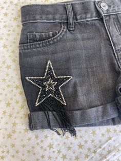 Yeehaw! The perfect denim shorts for summer are here! Beautiful star rhinestone tassel patches adorn the front of these shorts. Perfect paired with cowboy boots and a crop like our Bardot tee. Measurement chart is provided in photos. Shorts For Summer, Diy Shorts, Perfect Denim, Summer Is Here, Custom Shorts, Beaded Accessories, Measurement Chart, Black Denim Shorts, Summer Shorts