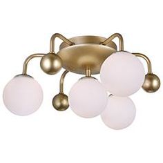 an image of a ceiling light with three lights on it's arms and four balls in the middle