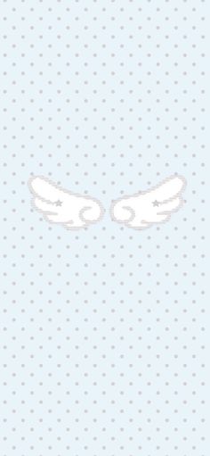 two white wings on a light blue background with polka dotes in the bottom right corner