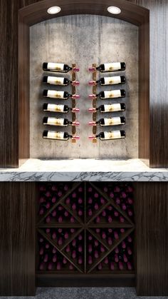 a wine rack with several bottles on it in the middle of a room filled with marble counter tops