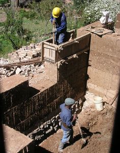 two men are working on the construction site