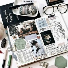 the contents of a planner spread out on a table with pens, scissors and other items