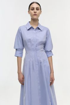 FALL 2024 WOMEN'S COLLECTION The Jazz Dress in Chambray Blue. This pintuck midi features a tailored bodice with a classic collar and elegant pintuck detailing. The flowing skirt and three-quarter sleeves add timeless sophistication to the design. Dress Fit: True to size. We recommend sizing up for individuals with a fuller bust. Jazz Dress, Flowing Skirt, Design Dress, Knitwear Tops, Pin Tucks, Fall 2024, Shop Swimwear, Three Quarter Sleeves, Cotton Poplin