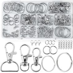 an assortment of metal parts and tools in a plastic container with clippings on the side