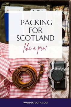 an open suitcase with the words packing for scotland like a pro on it and a camera