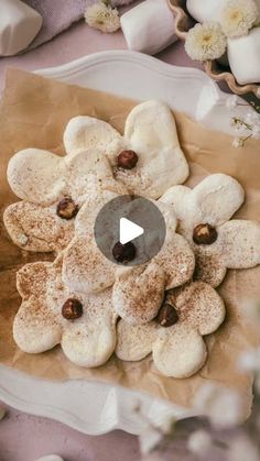 a plate with cookies and nuts on it