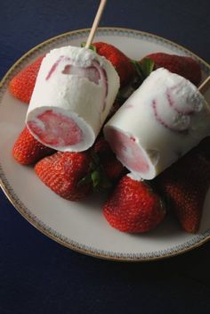 strawberries and marshmallows on a plate with toothpicks