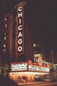 the chicago theatre marquee is lit up at night