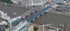 an aerial view of a city with bridges and buildings