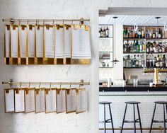 a bar with several menus hanging on the wall