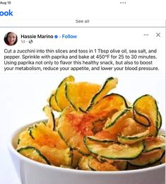 a white bowl filled with zucchini chips on top of a table