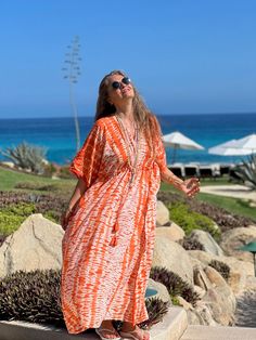 Our Orangina Needle Shibori kaftan is the most delicious color that you can imagine. It looks to be truly edible! This dress will absolutely "WOW" all those who see it and especially those who wear it! The Shibori method of tie dye is world renowned for its beauty and its Japanese origins, but few people know the that this technique has found a home with a unique set of artisans in India who have developed a unique twist: the “needle Shibori” method. Pieces from our Needle Shibori collection int Shibori, Gorgeous Dresses, Tie Dye, Twist, Maxi Dress, How To Wear, Beauty, Color