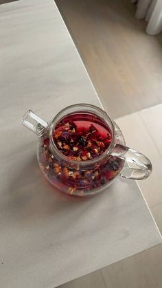 a glass jar filled with food sitting on top of a counter