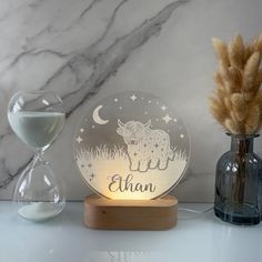 a personalized glass night light with an image of a sheep and stars on it