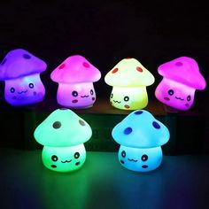 colorful mushroom shaped lights sitting on top of a table