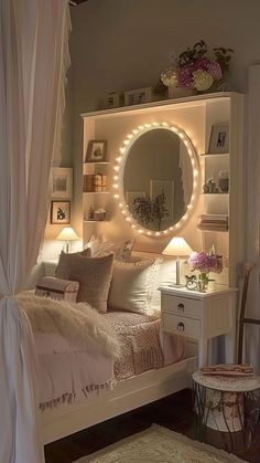 a white bed sitting under a round mirror