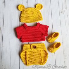 a crocheted winnie the pooh outfit, booties and hat is shown