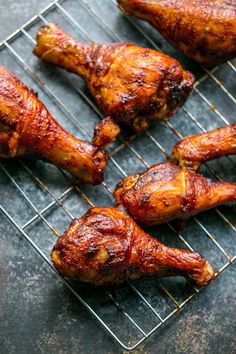 several pieces of chicken sitting on top of a metal rack