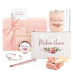 the contents of a mother's day gift set including a mug, keychain, and other items