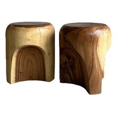 two wooden stools sitting next to each other