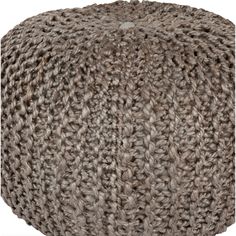 a round ottoman made out of yarn