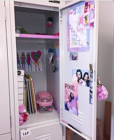 a white locker with pictures and pink decorations