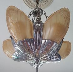 a chandelier hanging from the ceiling in a room