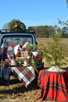 the back of a pickup truck filled with christmas decorations and gifts on top of it