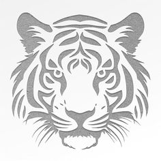 a tiger's head is shown in the shape of a stencil on a white background