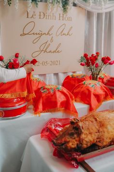 there is a large piece of meat on the table with red cloths around it