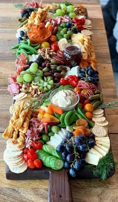 a wooden table topped with lots of different types of food