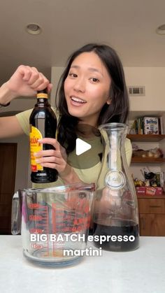 a woman is pouring something into a blender