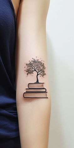 A tattoo of a tree blossoming from an open book, symbolizing the union of nature's tales and literary wonders. Tiffany Tattoo, Geometric Tattoo Tree, Black Crow Tattoos, Jasmine Tattoo, Nature Tattoo Ideas, Cool Nature, Hourglass Tattoo, Literary Tattoos, Pen Tattoo