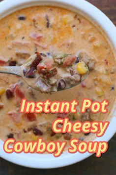 a bowl of instant pot cheesy cowboy soup with a spoon in it and the words instant pot cheesy cowboy soup