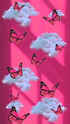 many pink butterflies flying in the sky above clouds with bright light coming through them on a pink background