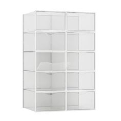 a white shelving unit with clear bins on the top and bottom shelves in front