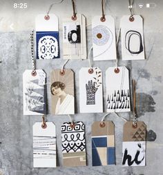 several tags are hanging on the wall with different patterns and designs attached to each one