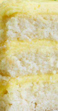 a piece of yellow cake with white frosting