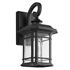 a black outdoor light on a white background