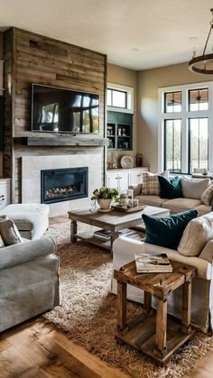 a living room filled with furniture and a flat screen tv mounted on the wall above a fireplace