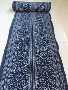 a blue and white rug on the floor