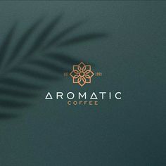 the logo for aroma coffee is shown on a dark green background with a palm leaf