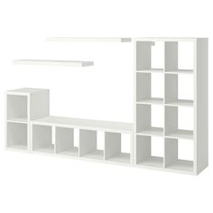 a white shelf with several shelves and some bookshelves on the top one is empty